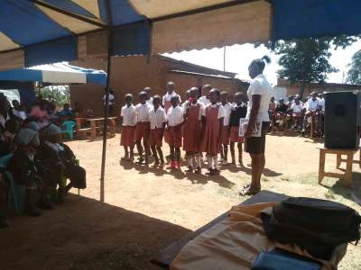 One of the teaching staff guiding the presentations  at Shining Star Junior School