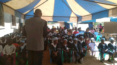 Students reaceiving a word of devotion from Pastor Daniel (one of the spiritual guider of the school) at Shining Star Junior School